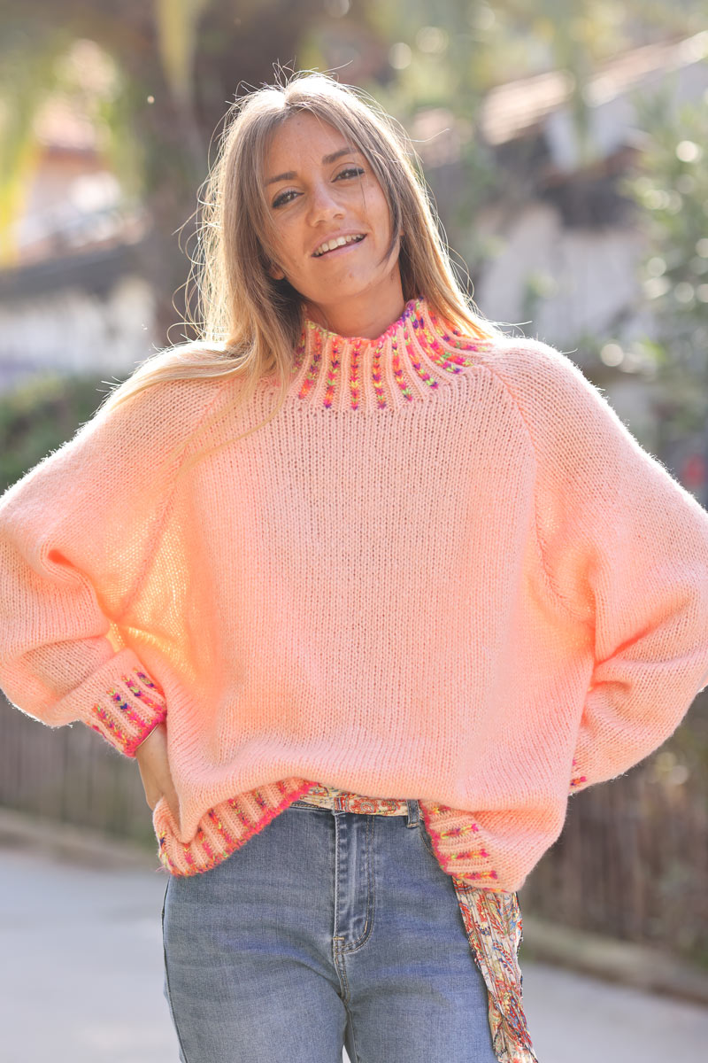 Soft knit sweater in salmon with funnel neck multicoloured stitching