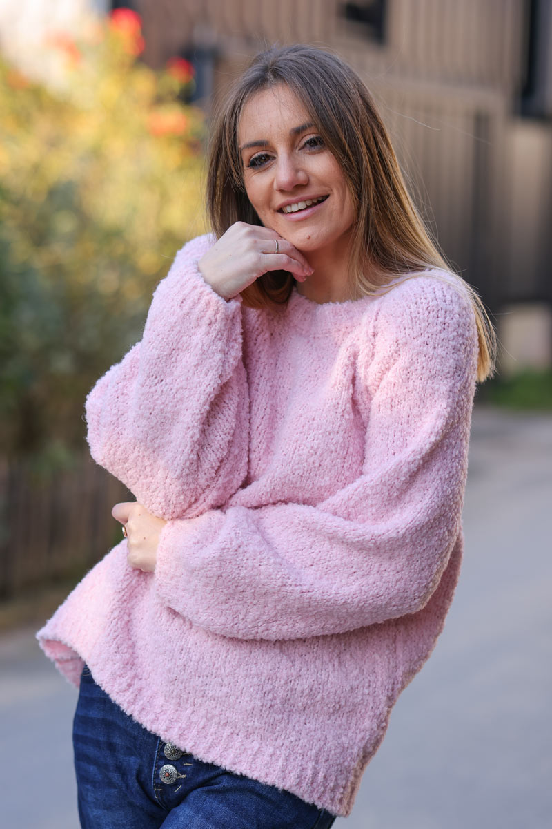 Soft pink bouclette knit sweater with inside out seams