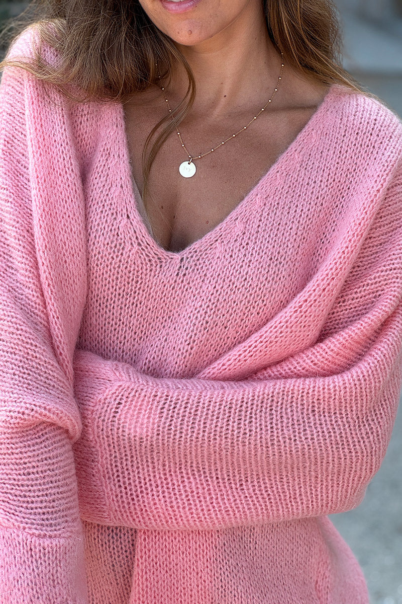 Pull rose saumon en maille col v manches chauve souris
