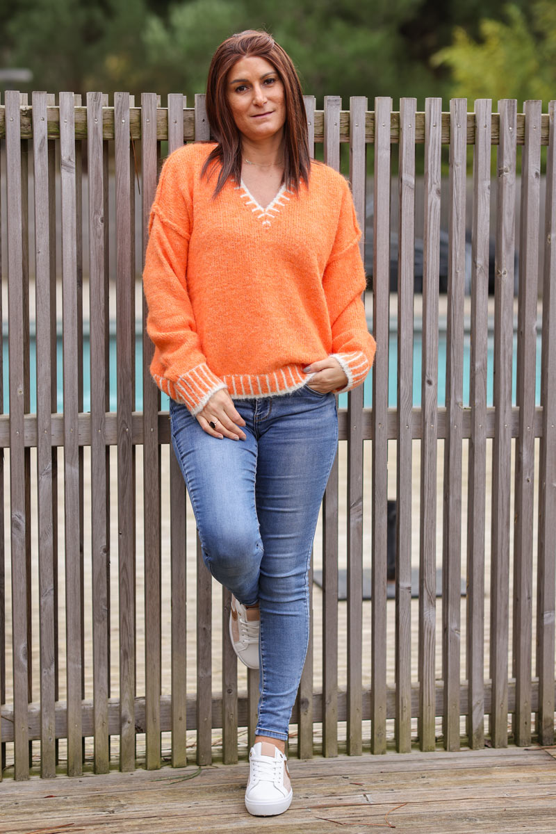 Super soft v-neck sweater in orange with white stitching detail