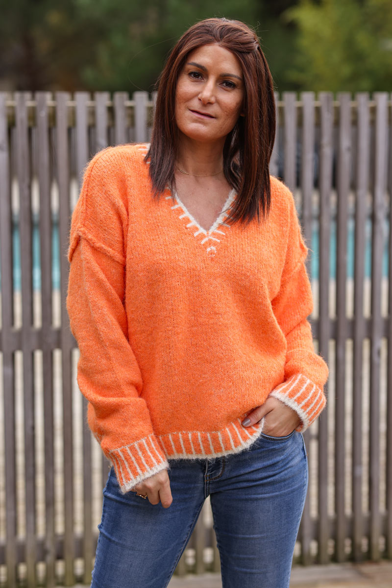 Super soft v-neck sweater in orange with white stitching detail