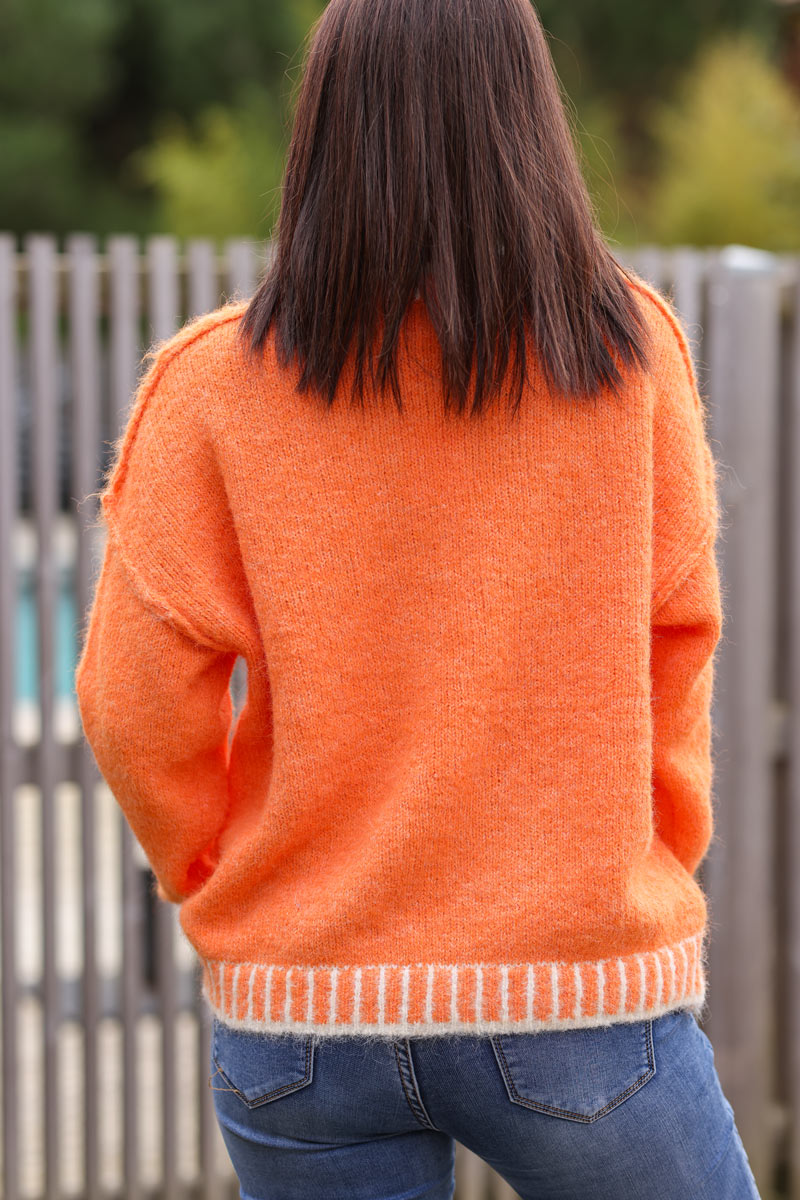 Super soft v-neck sweater in orange with white stitching detail