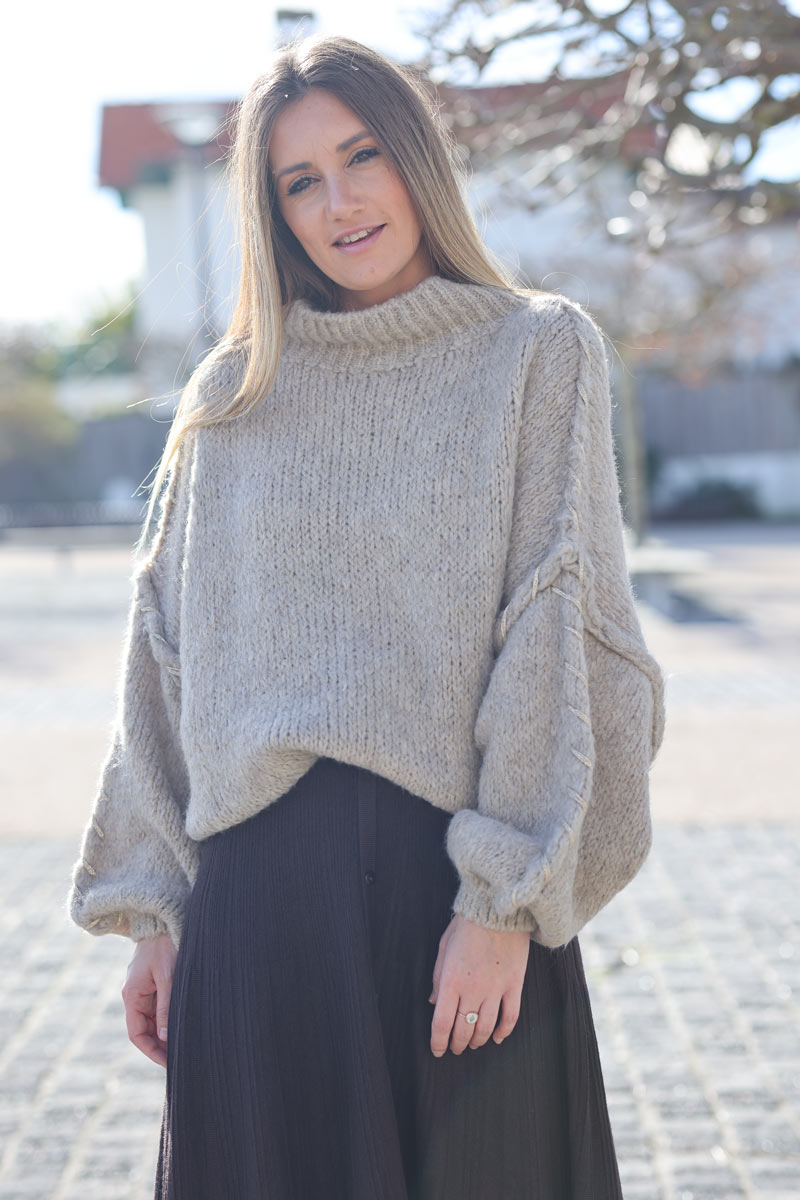 Oversized chunky knit sweater in beige with gold seam stitching detail