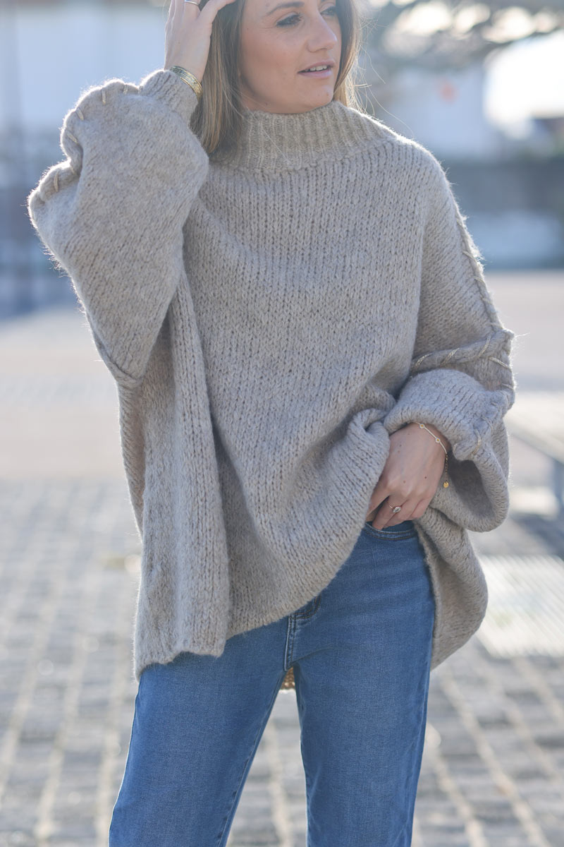 Oversized chunky knit sweater in beige with gold seam stitching detail