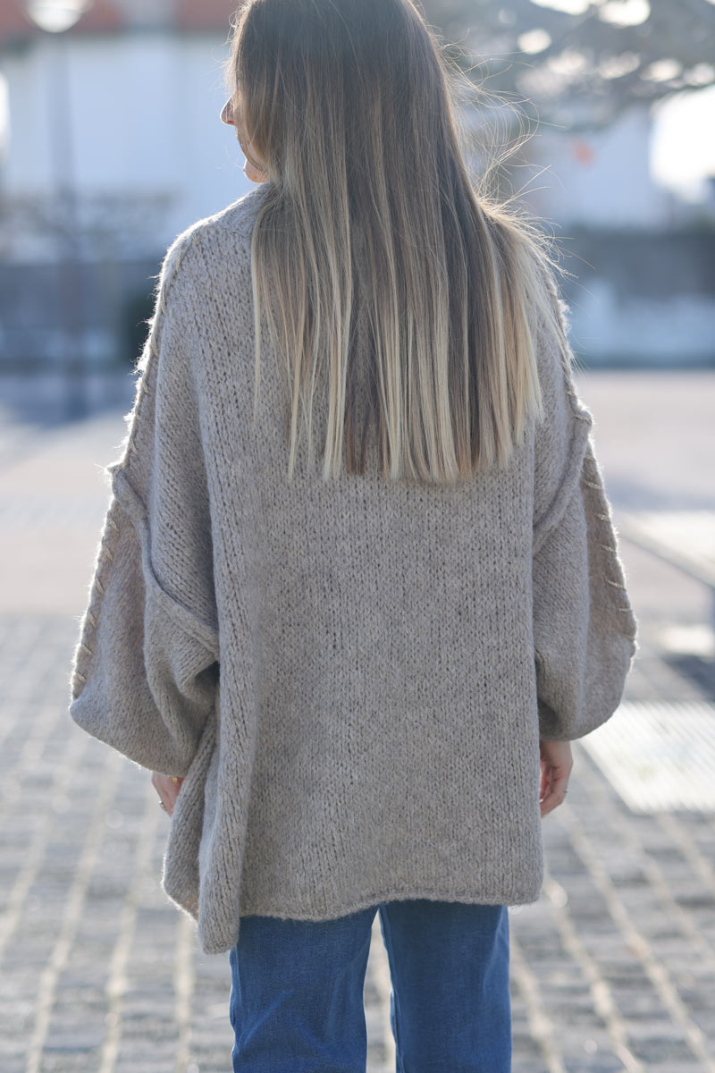 Oversized chunky knit sweater in beige with gold seam stitching detail