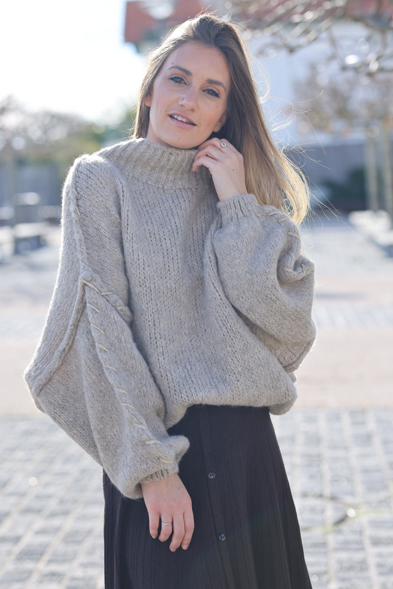 Oversized chunky knit sweater in beige with gold seam stitching detail