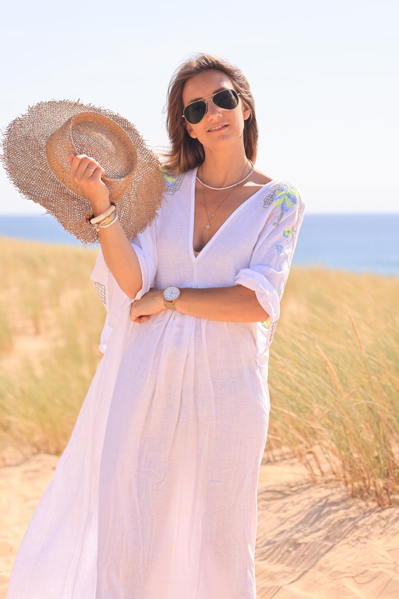 White maxi dress with batwing sleeves and colorful shoulder embroidery