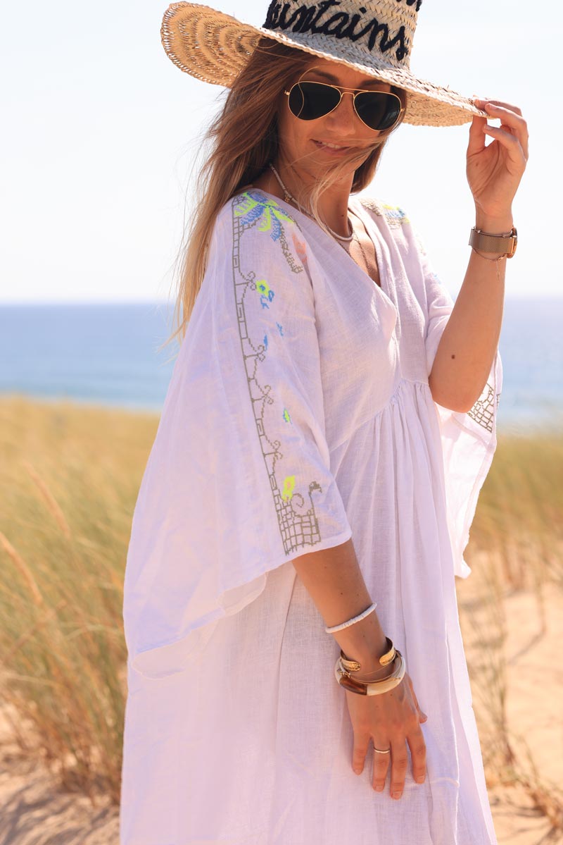 White maxi dress with batwing sleeves and colorful shoulder embroidery