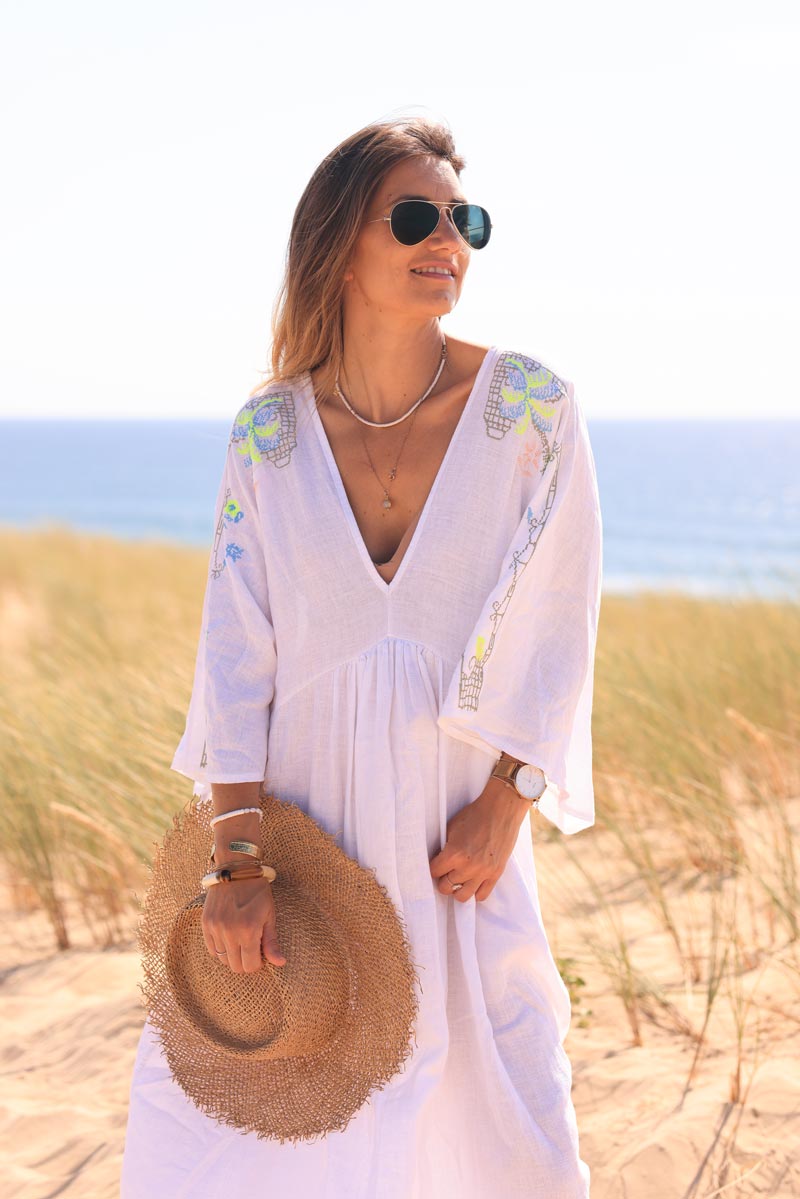 White maxi dress with batwing sleeves and colorful shoulder embroidery