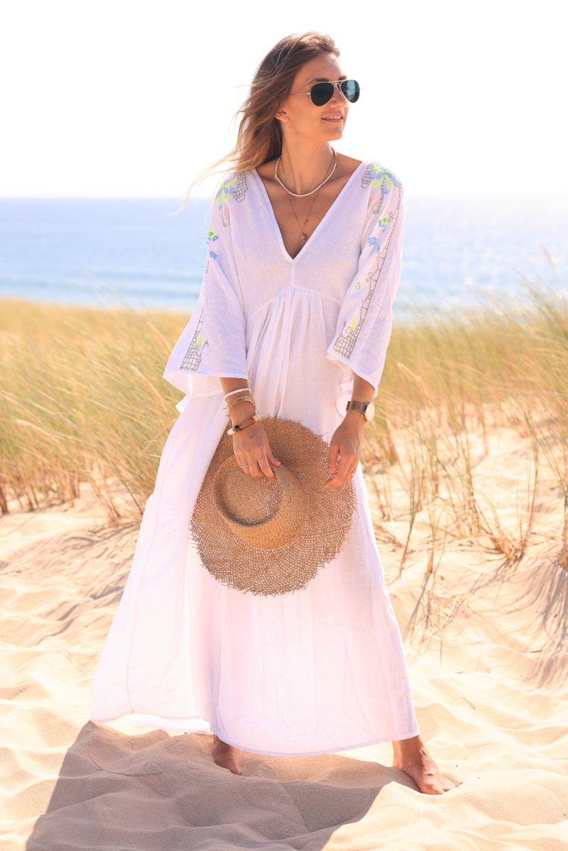 White maxi dress with batwing sleeves and colorful shoulder embroidery