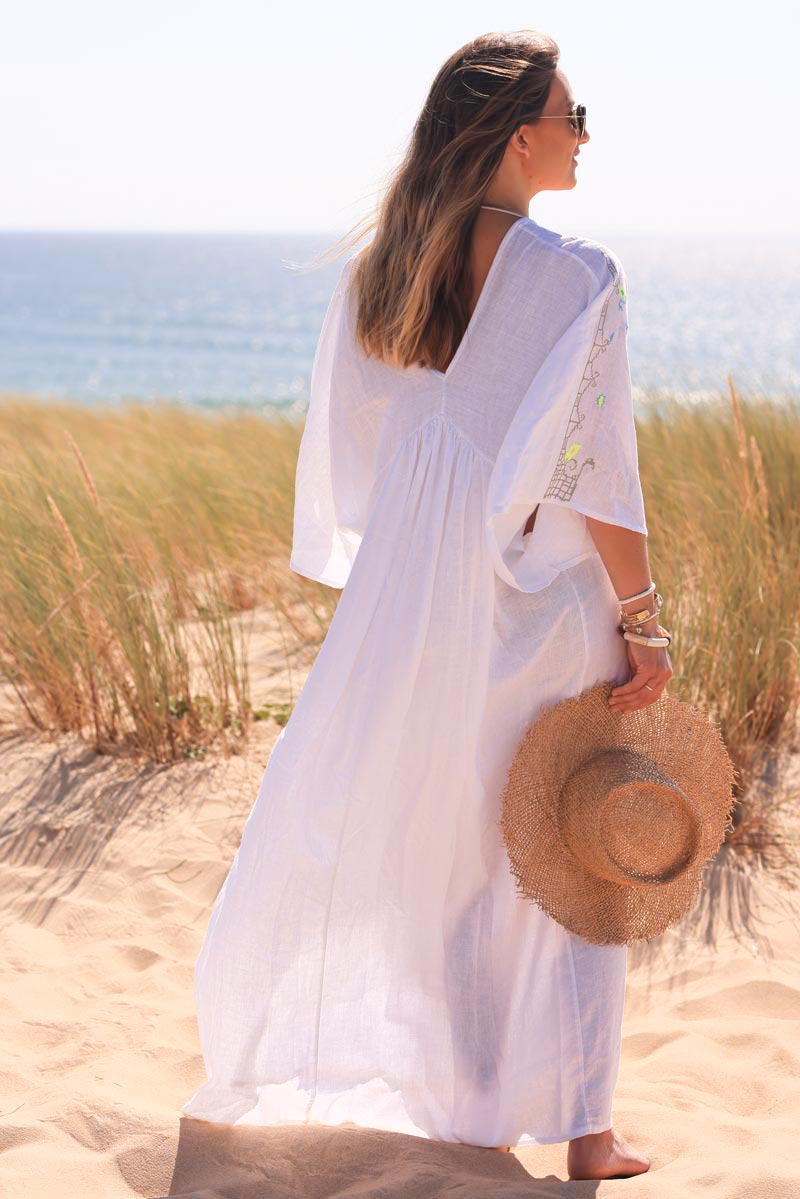 White maxi dress with batwing sleeves and colorful shoulder embroidery