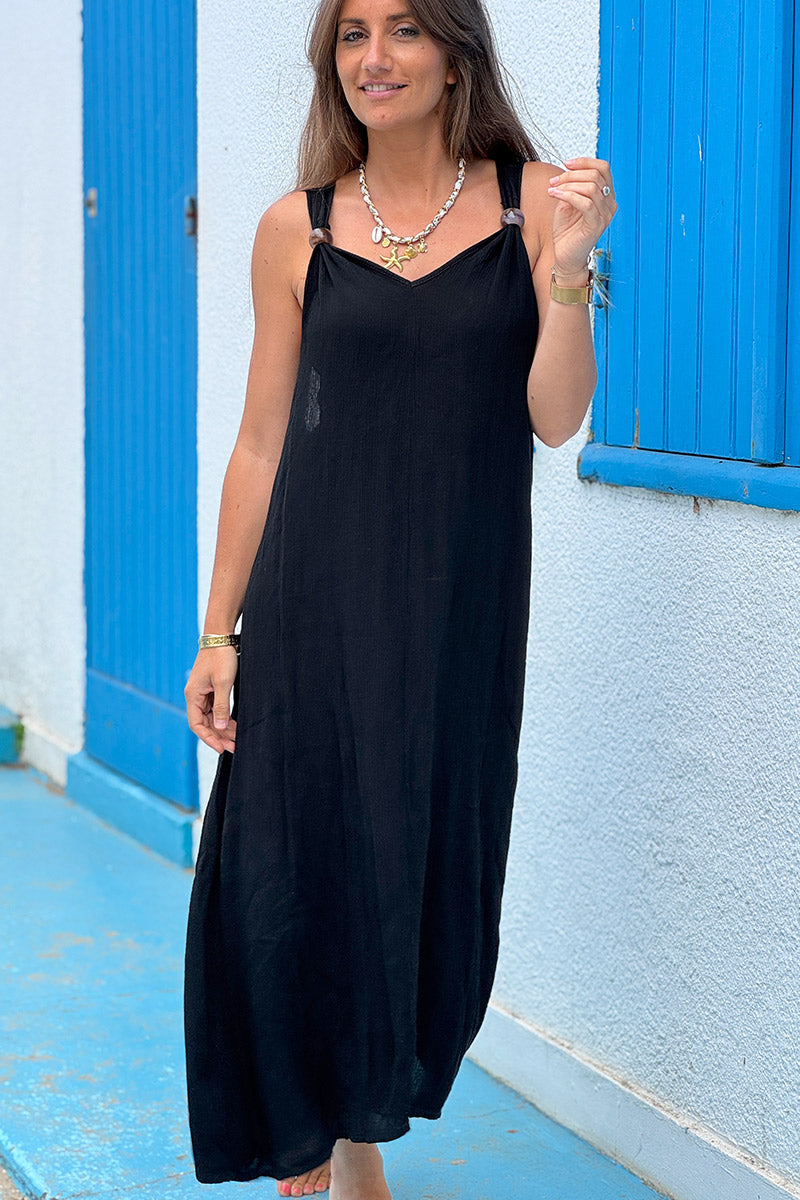 Robe longue et fluide noire bretelles détail grosses perles écaille
