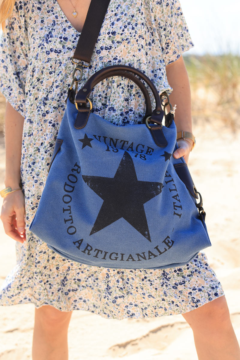 Bolso de mano de algodón denim azul y asas de piel con logo de estrella vintage