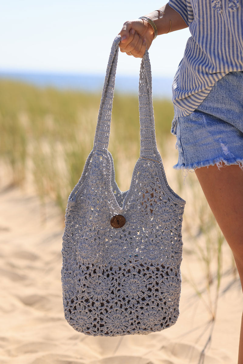 Pastel blue crochet bag with wooden button