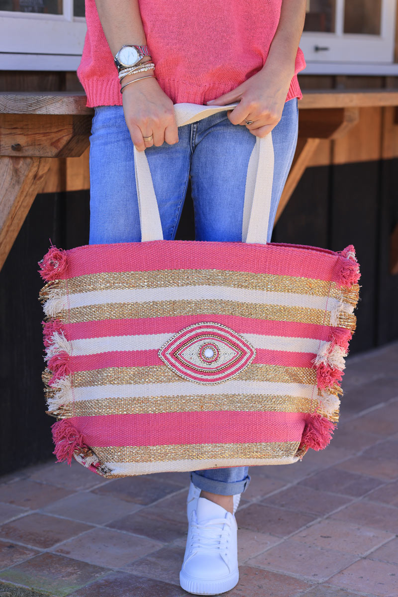 Woven tote bag in fuchsia, beige and gold with beaded eye design