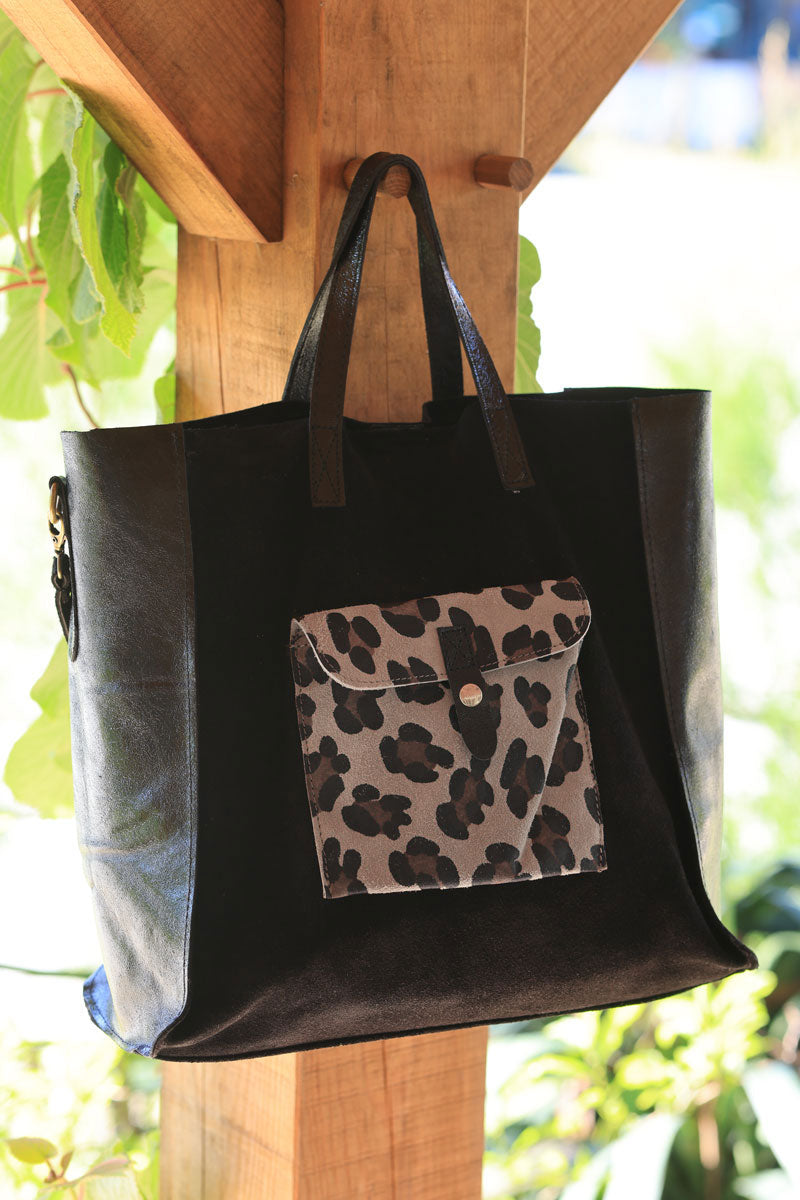 Black leather shoulder bag with leopard print pocket and metallic handles