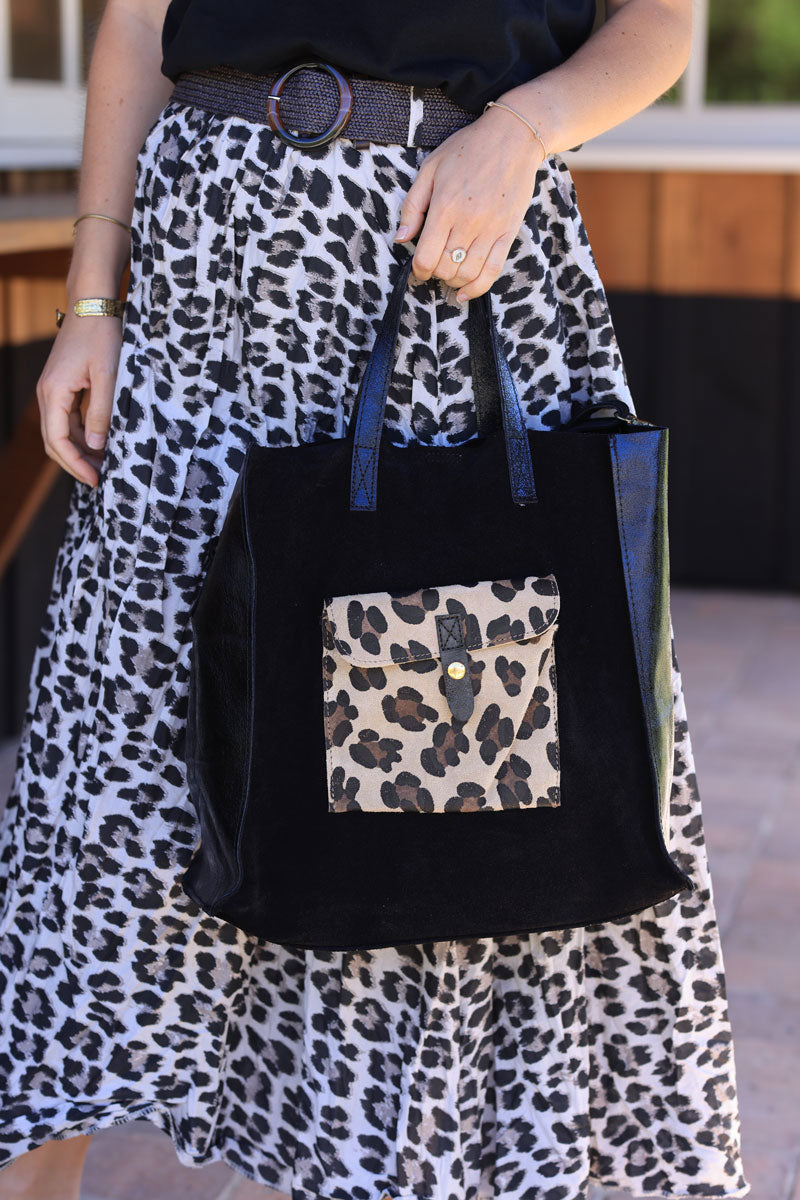 Black leather shoulder bag with leopard print pocket and metallic handles