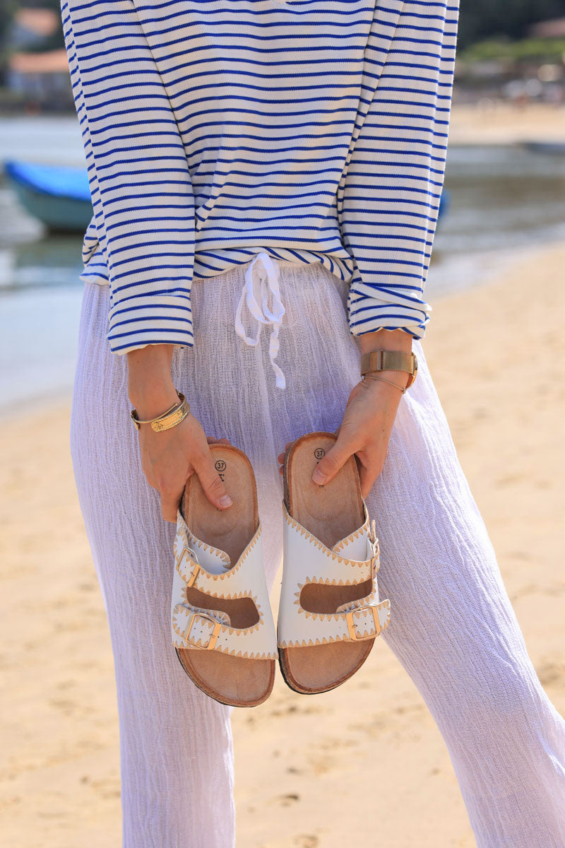 White faux leather sandals with double straps and gold embroidery