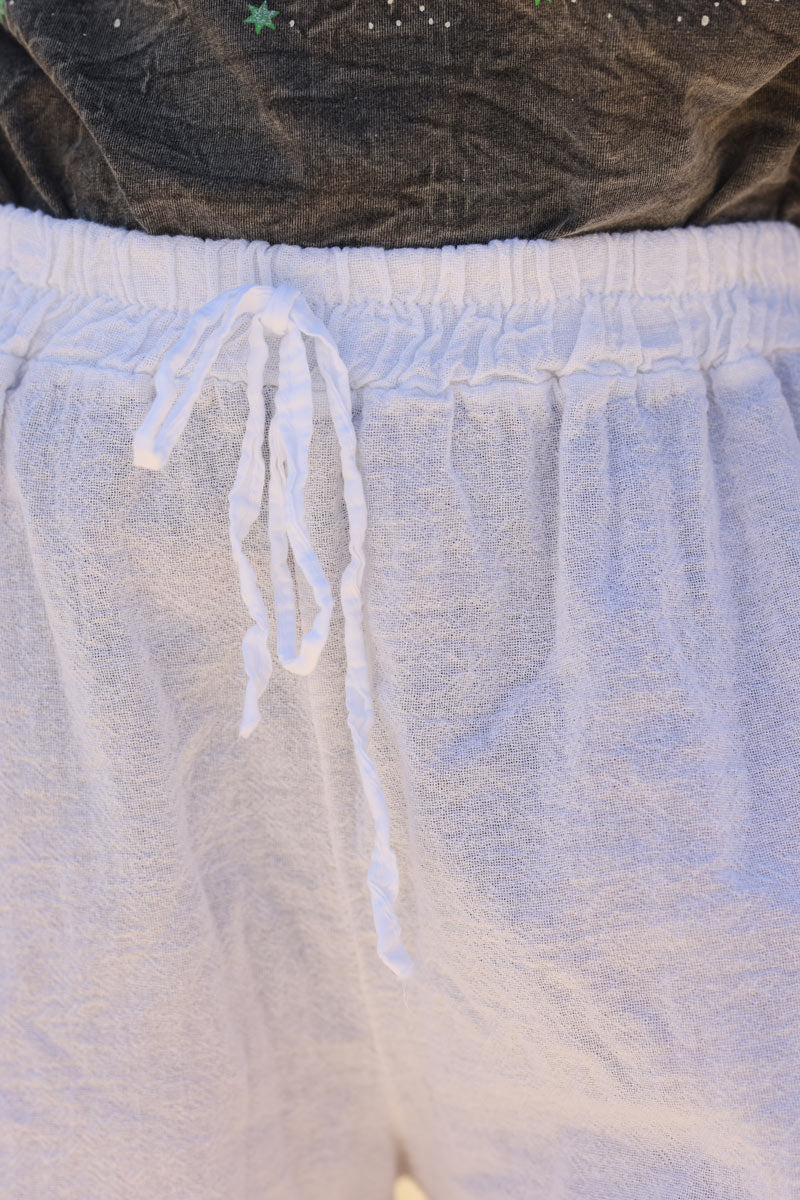 Short souple blanc en coton taille elastique finitions petites franges h118 (1)