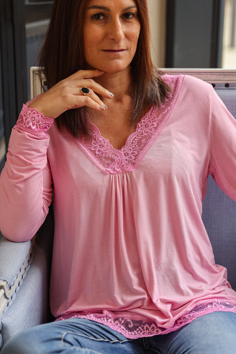 Pink long sleeved v-neck top with lace trim