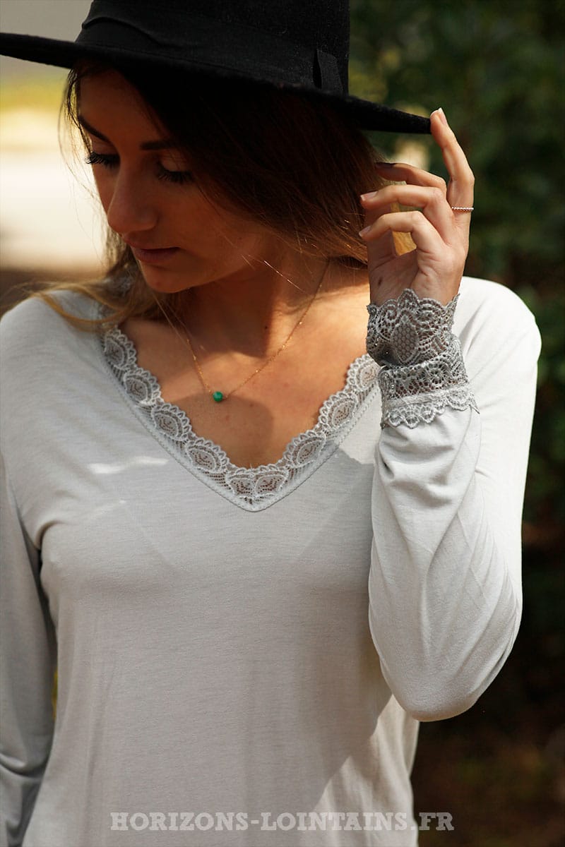 Light gray long sleeved top with lace trim