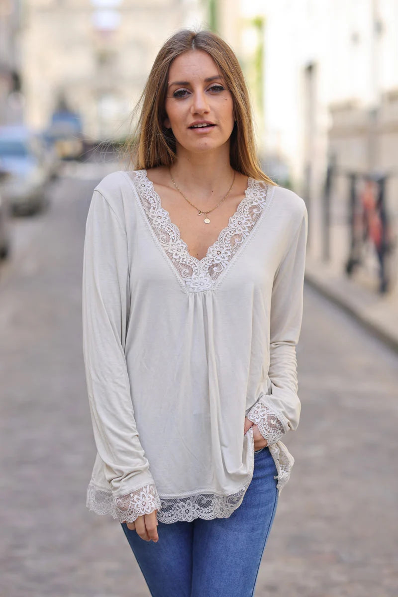 Beige long sleeved v-neck top with lace trim