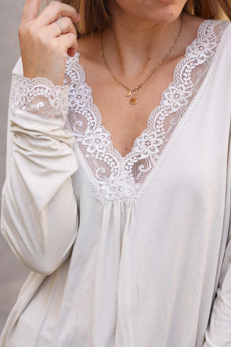 Beige long sleeved v-neck top with lace trim