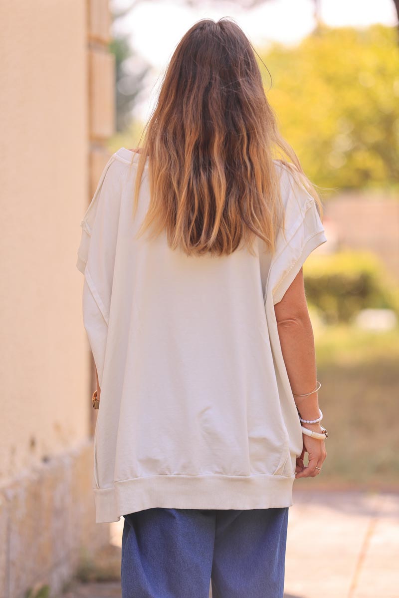 Off white loose sleeveless sweater with seams detail