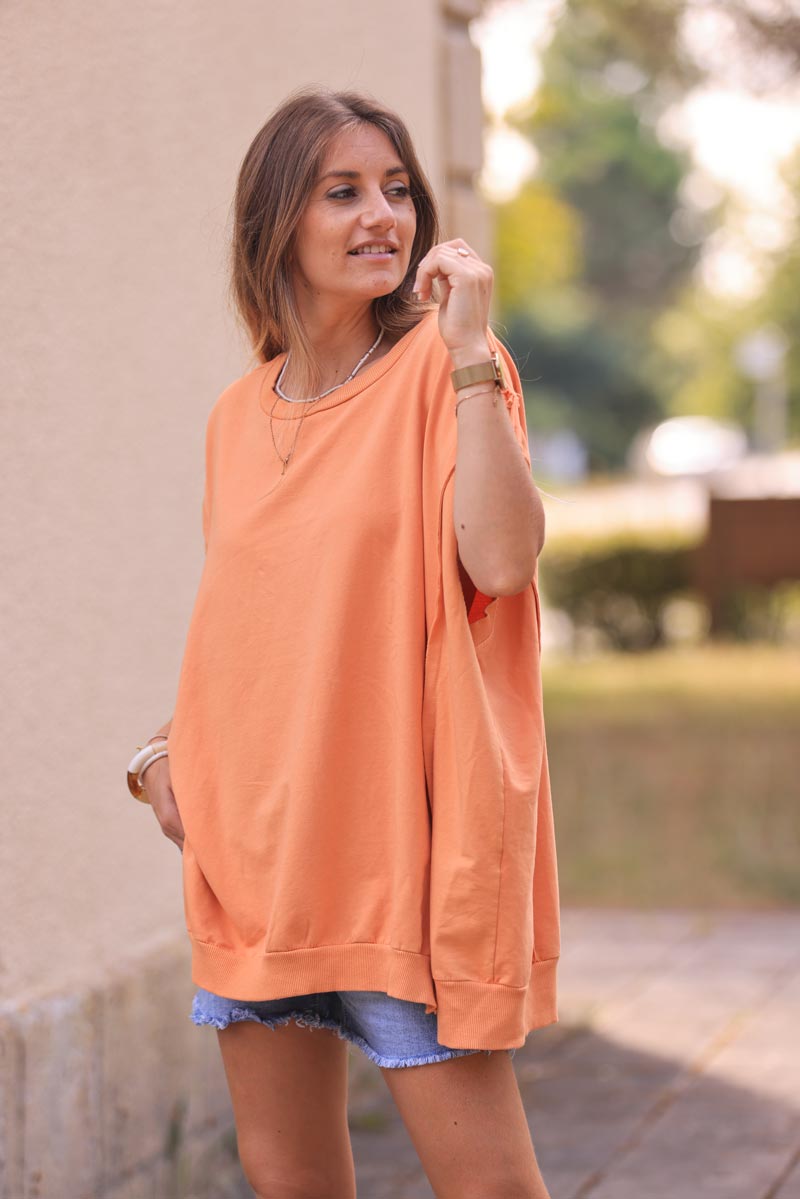 Sweat loose sans manches orange pastel coutures apparentes