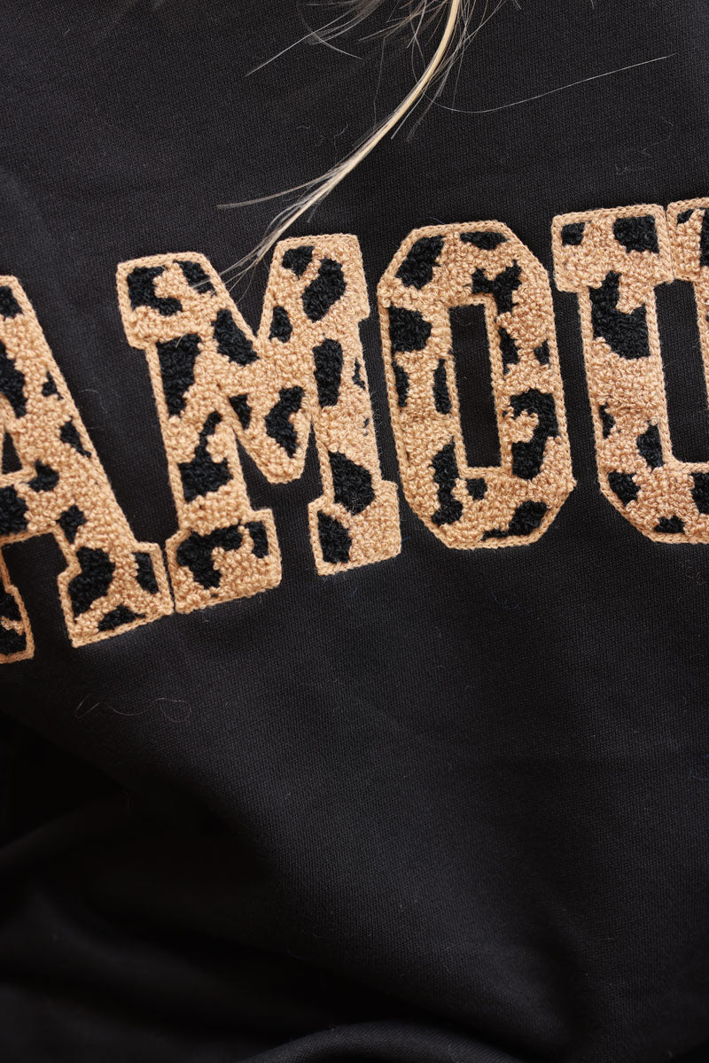 Sudadera negra con bordado de rizo leopardo Amour