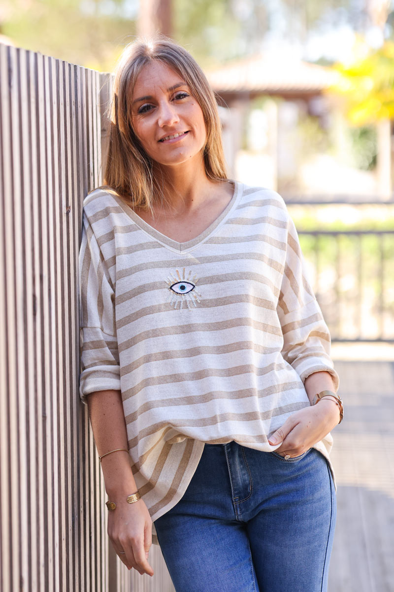 Sailor style beige striped top with sequin eye symbol