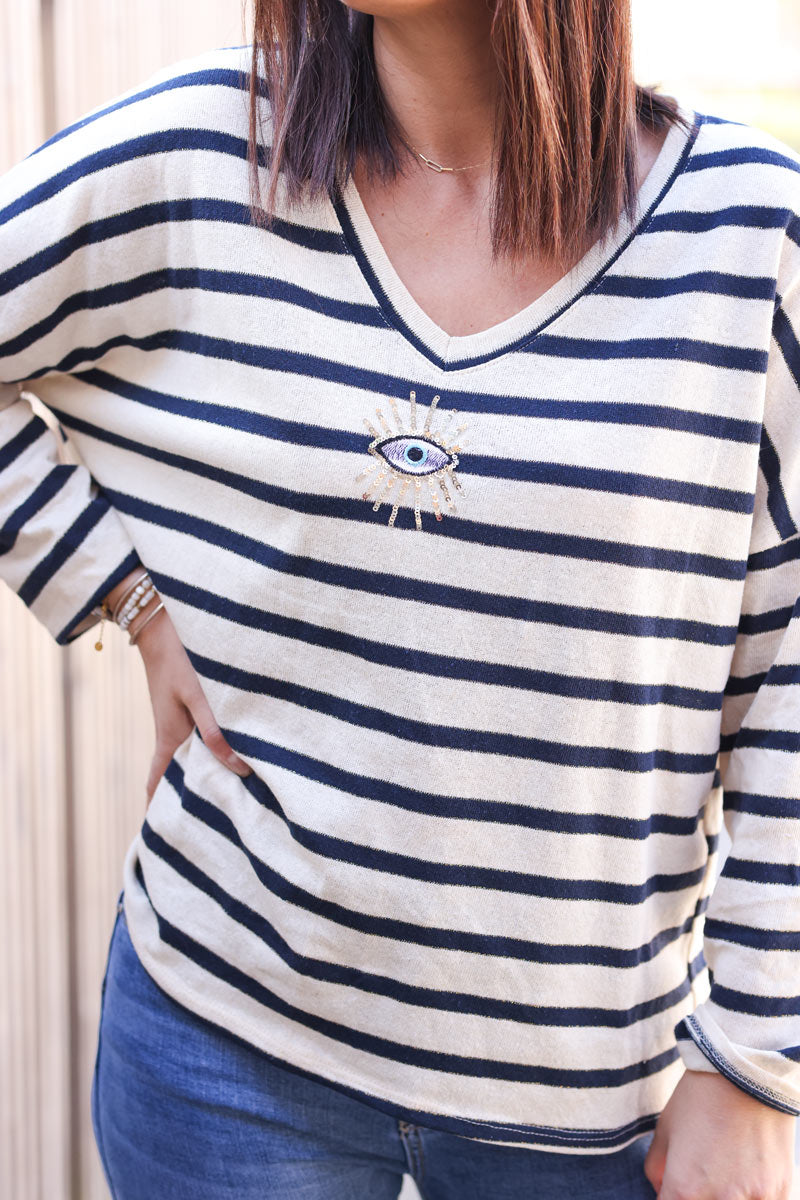 Sailor style navy blue striped top with sequin eye symbol