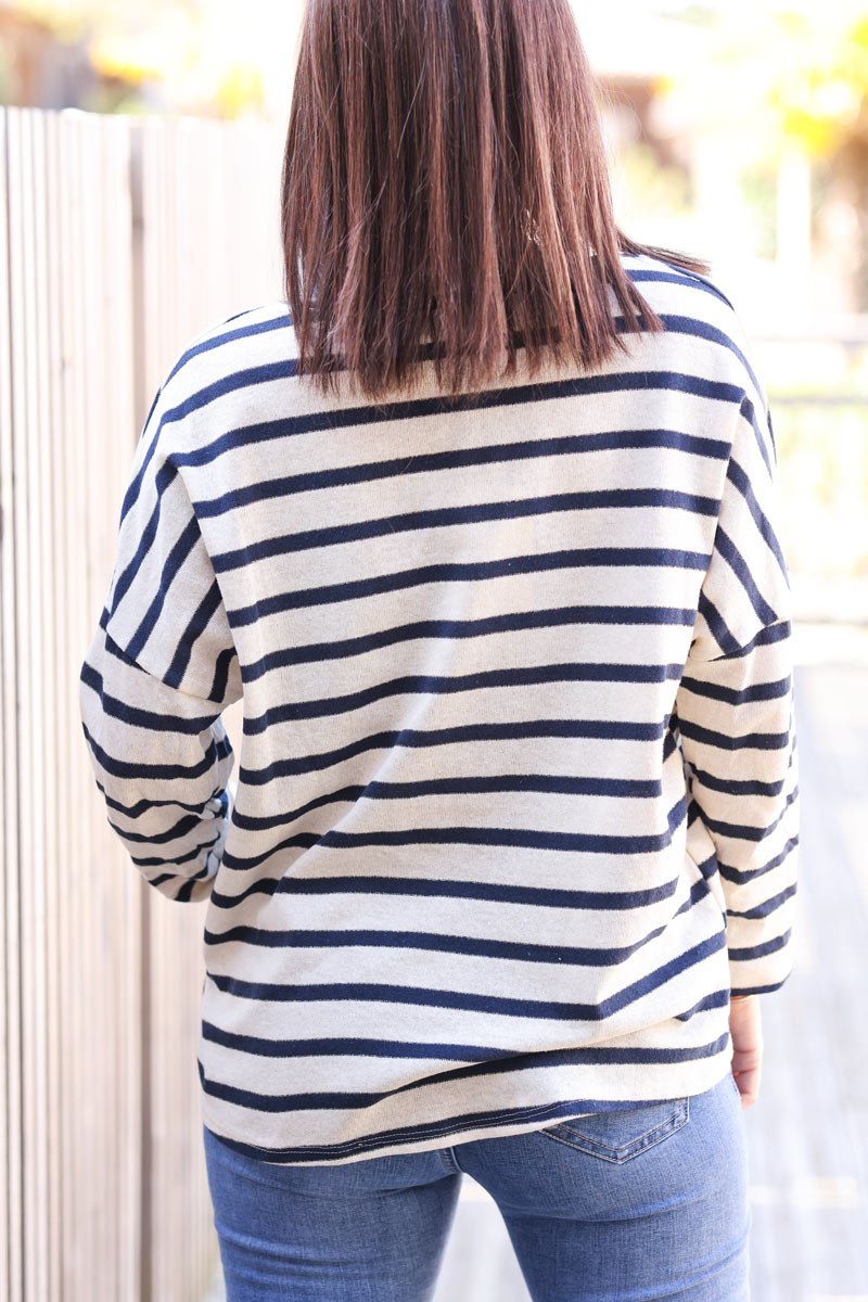 Sailor style navy blue striped top with sequin eye symbol