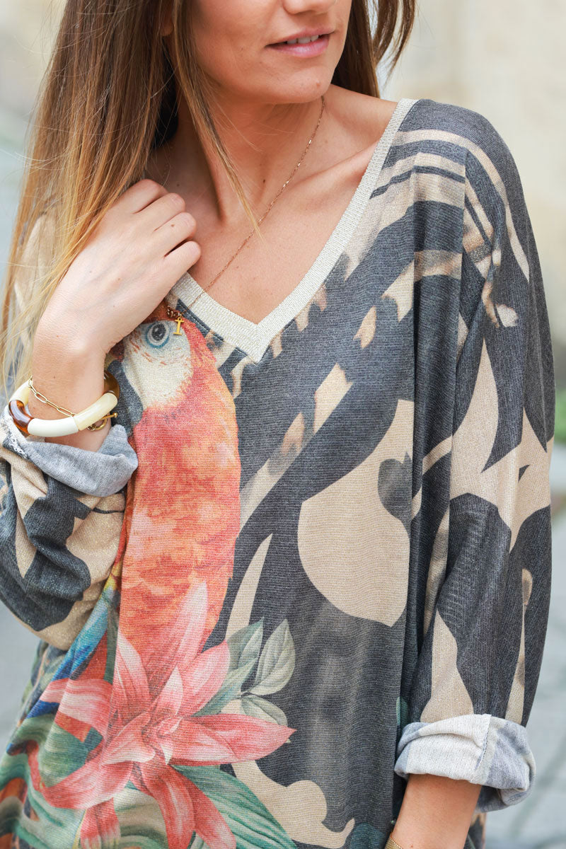 Shiny beige and black v-neck top with colorful ara parrot print