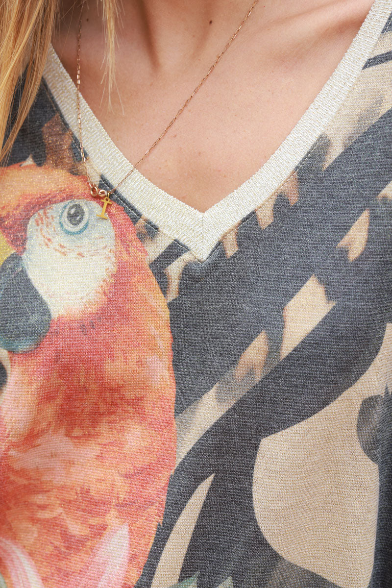 Shiny beige and black v-neck top with colorful ara parrot print