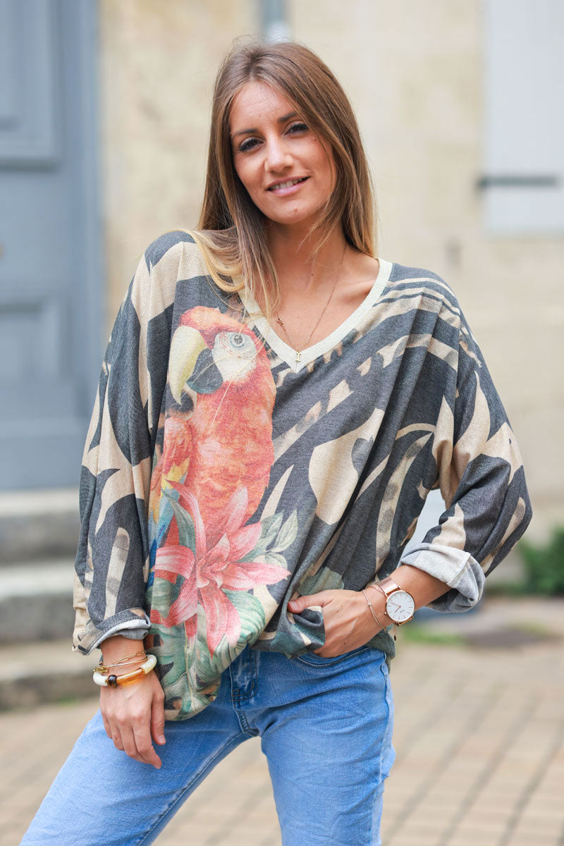 Shiny beige and black v-neck top with colorful ara parrot print