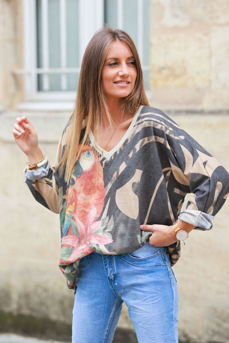 Shiny beige and black v-neck top with colorful ara parrot print