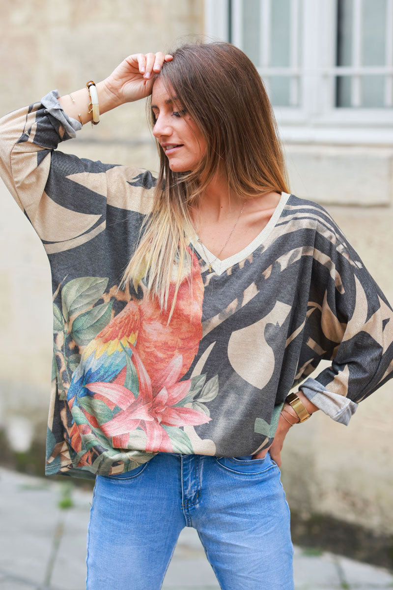 Shiny beige and black v-neck top with colorful ara parrot print