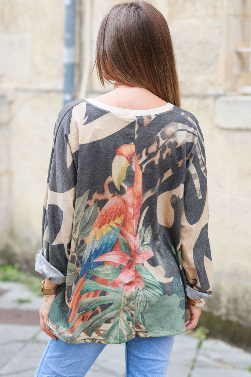 Shiny beige and black v-neck top with colorful ara parrot print