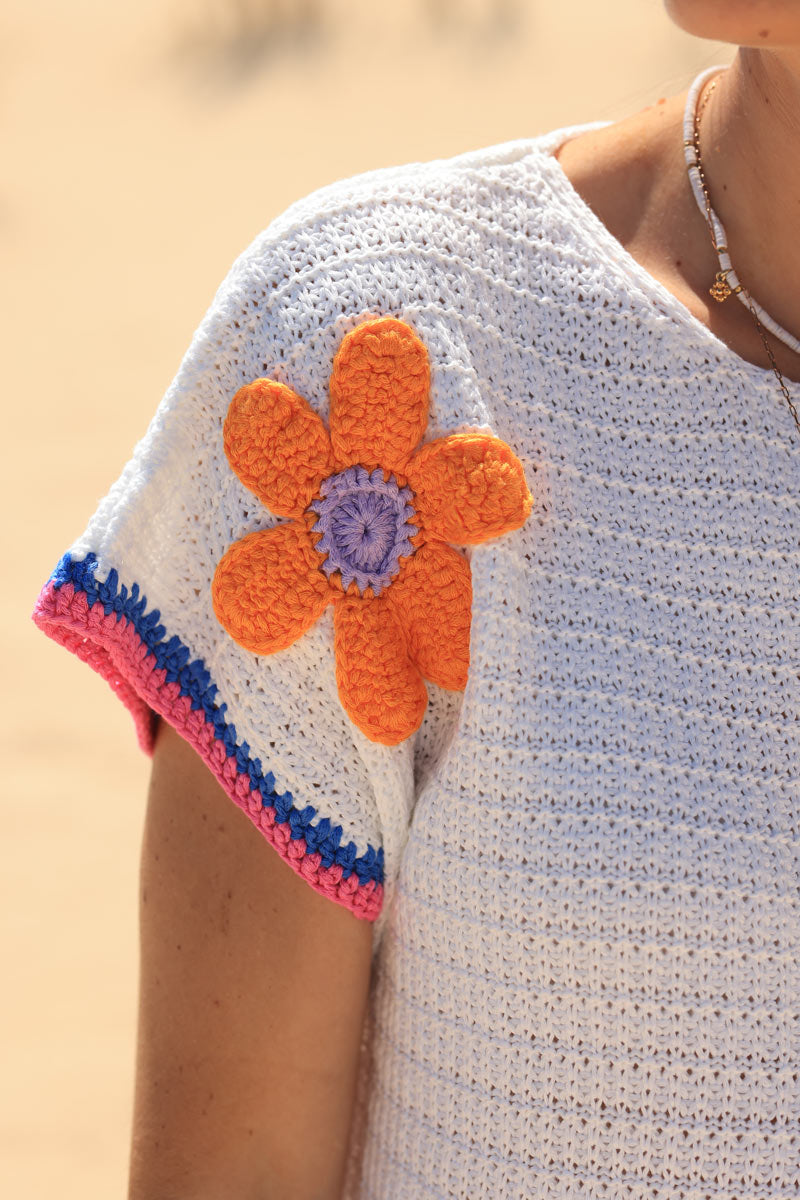 White crochet short sleeve top with colourful flowers