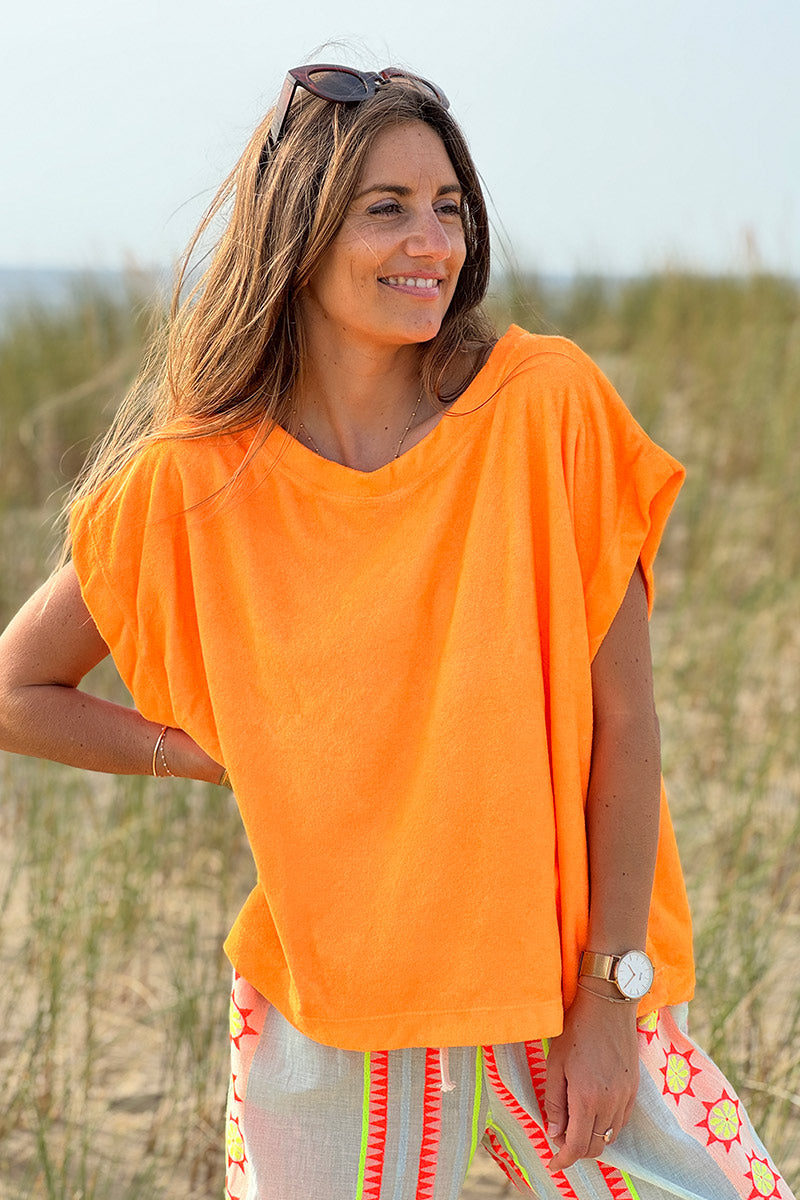 Top holgado de color naranja fluorescente en suave tejido de rizo