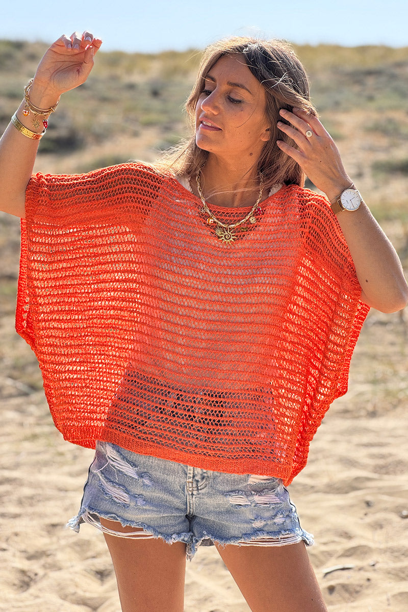 Top orange manches chauves souris et col rond en maille ajourée effet crochet