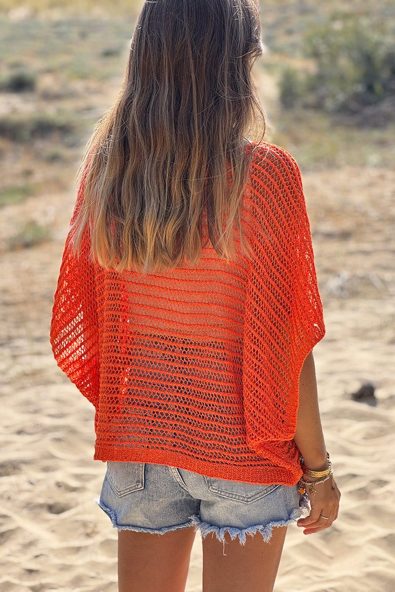 Top orange manches chauves souris et col rond en maille ajourée effet crochet