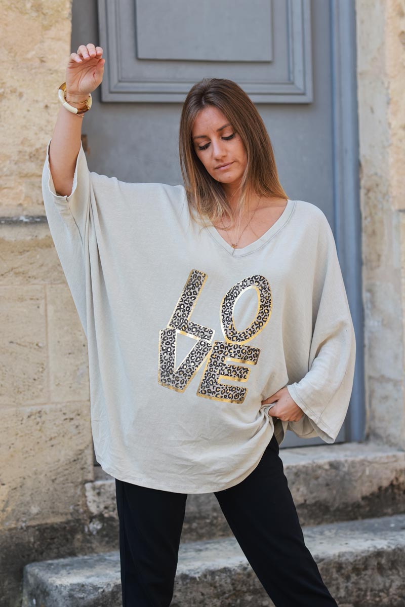 Beige stretch fine knit batwing top with Love print