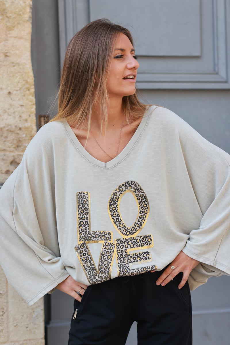 Beige stretch fine knit batwing top with Love print