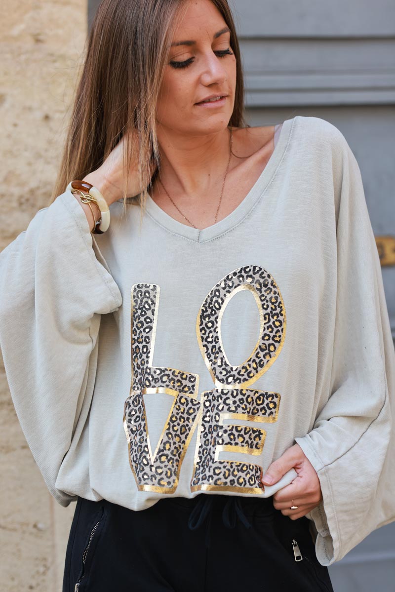 Top amplio y holgado elástico beige manga murciélago LOVE leopardo