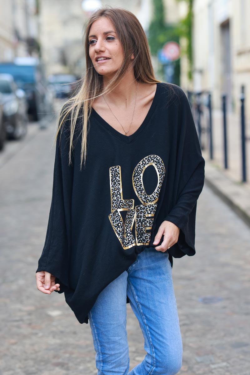 Black stretch fine knit batwing top with Love print