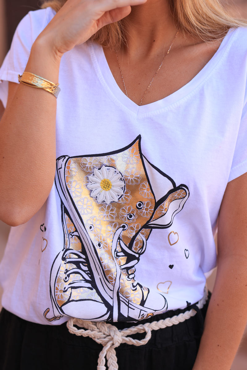 White cotton t-shirt with gold sneaker design and embrodered daisy