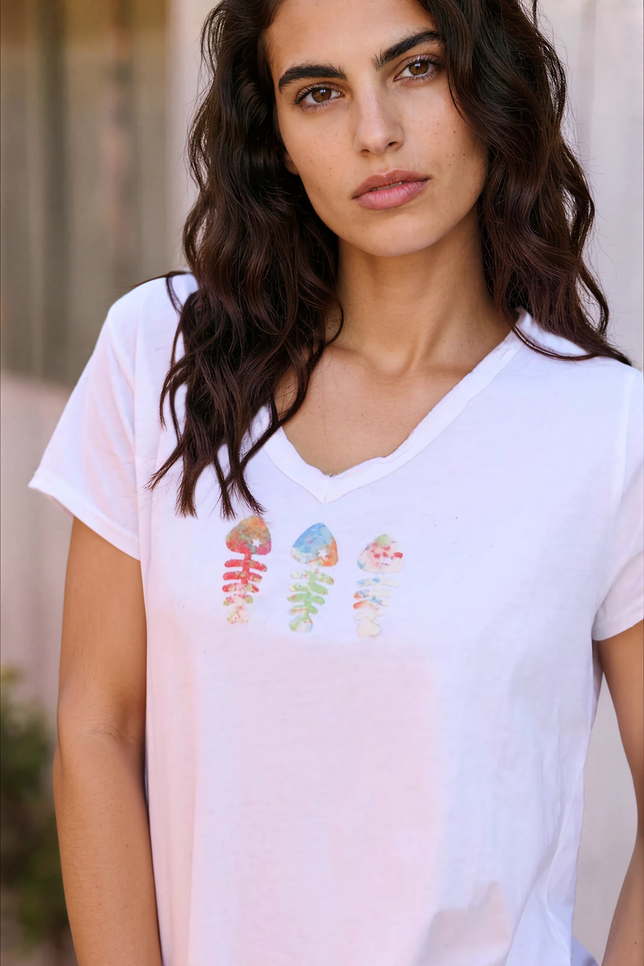 White cotton t-shirt with raw collar and trio colored fish