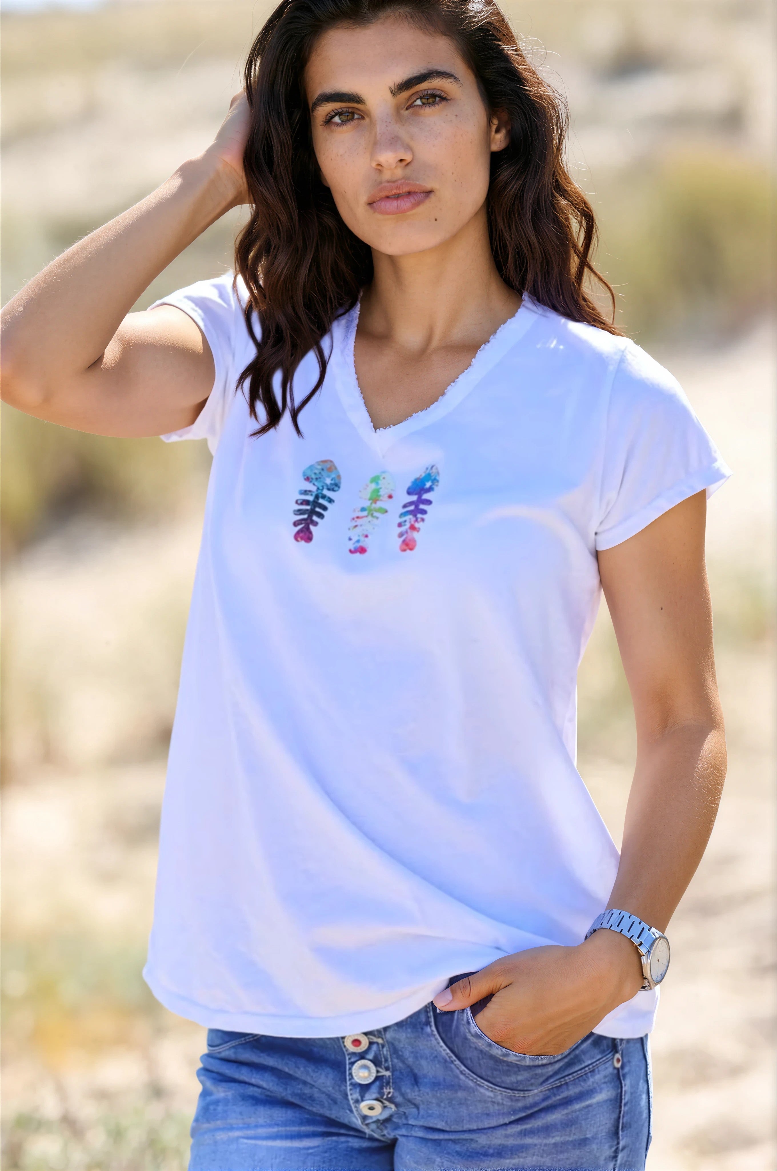 White cotton t-shirt with raw collar and trio colored fish